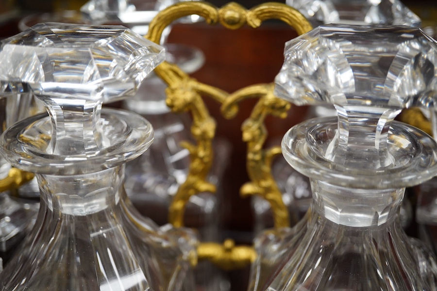 A 19th century Boulle panelled and decorative brass work liqueur cabinet, the interior fitted with gilt fitments, four cut glass decanters and sixteen liqueur glasses, 34cm wide, 26cm high. Condition - minor scratches to